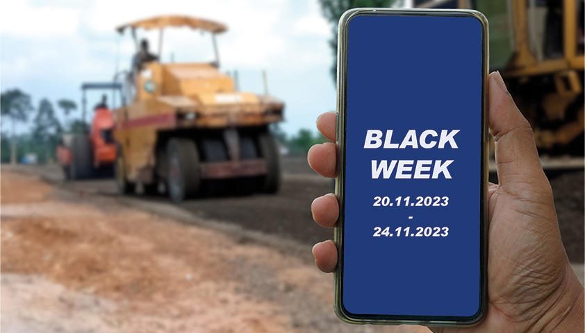 MORAVIA Akademie Aktuell: Black Friday Angebote Ankündigung der Black Week auf einem Handy, im Hintergrund ist eine Baustelle zu sehen.